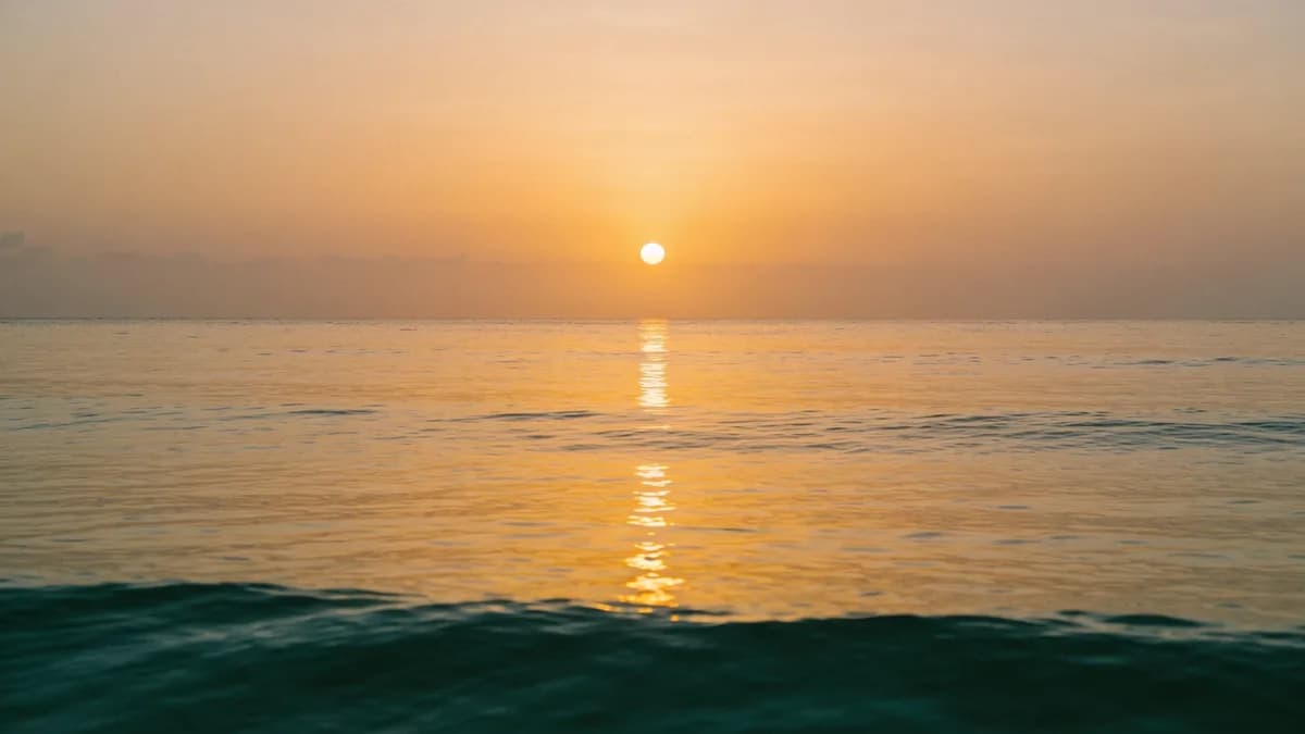 Golden sunset reflected across a calm ocean